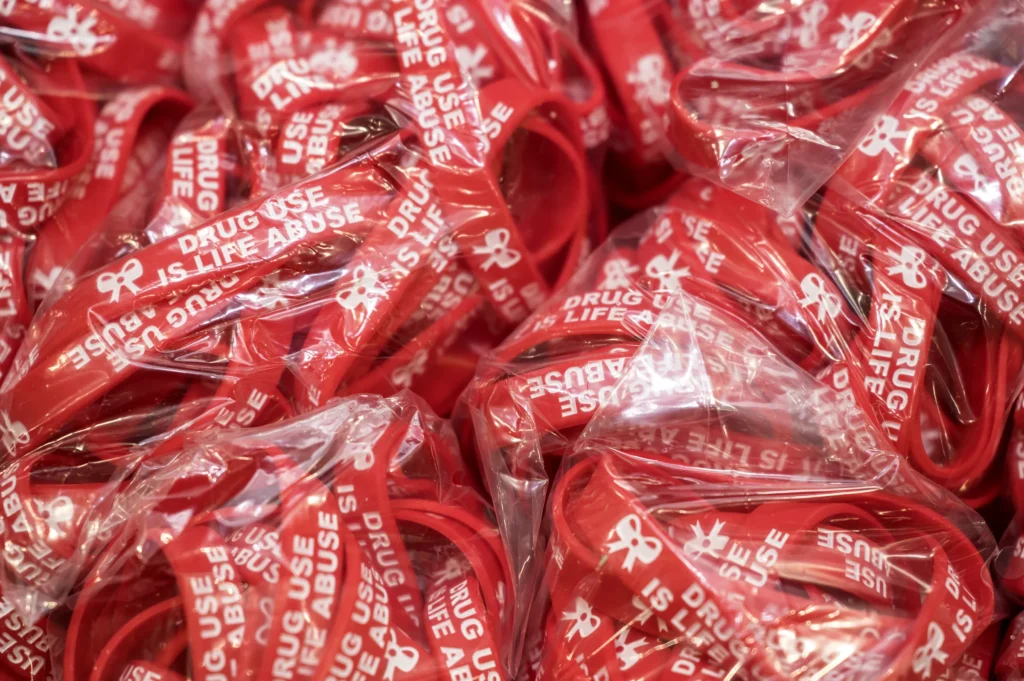 Bags of red “Drug Use Is Life Abuse” wristbands for Red Ribbon Week 2026